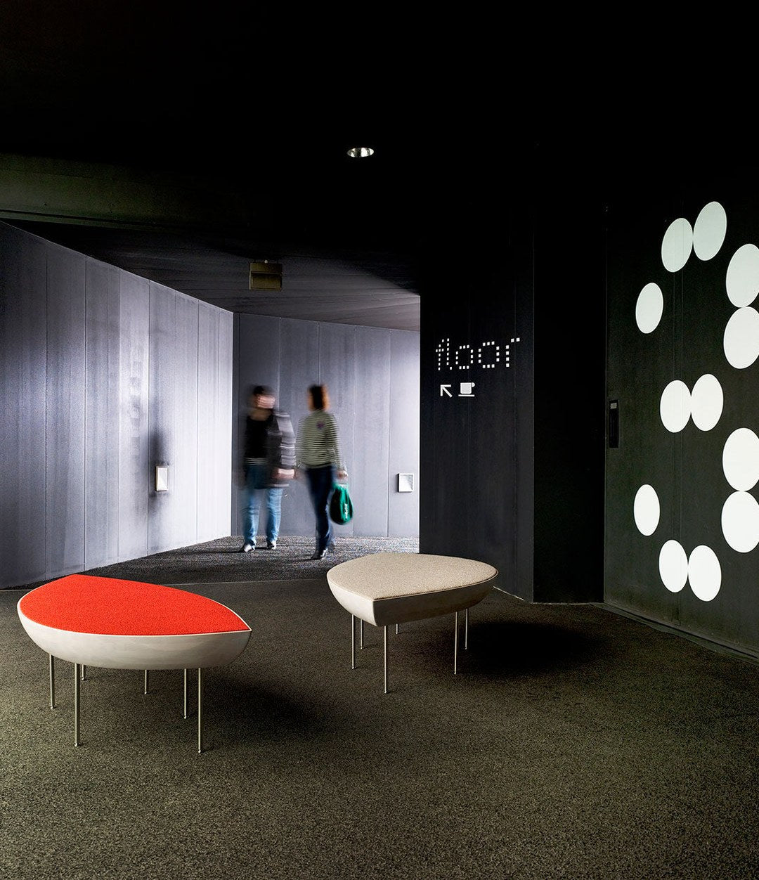 Konoha Bench by Sancal in red and beige in a dark lobby – In Dubai by WSPR