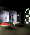 Konoha Bench by Sancal in red and beige in a dark lobby – In Dubai by WSPR