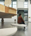 Konoha Bench by Sancal in a gallery with a visitor – In Dubai by WSPR