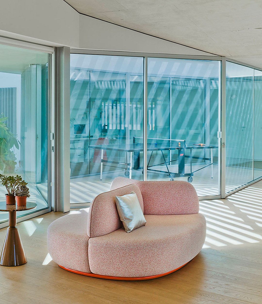 La Isla Bench by Sancal in pink in a glass pavilion – In Dubai by WSPR