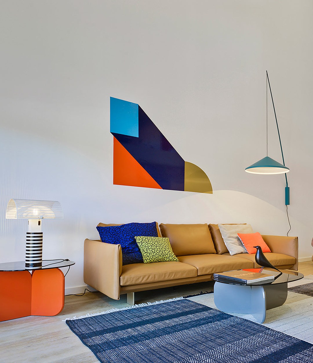 La Isla Coffee Table by Sancal in orange and pale blue beside a sofa – In Dubai by WSPR