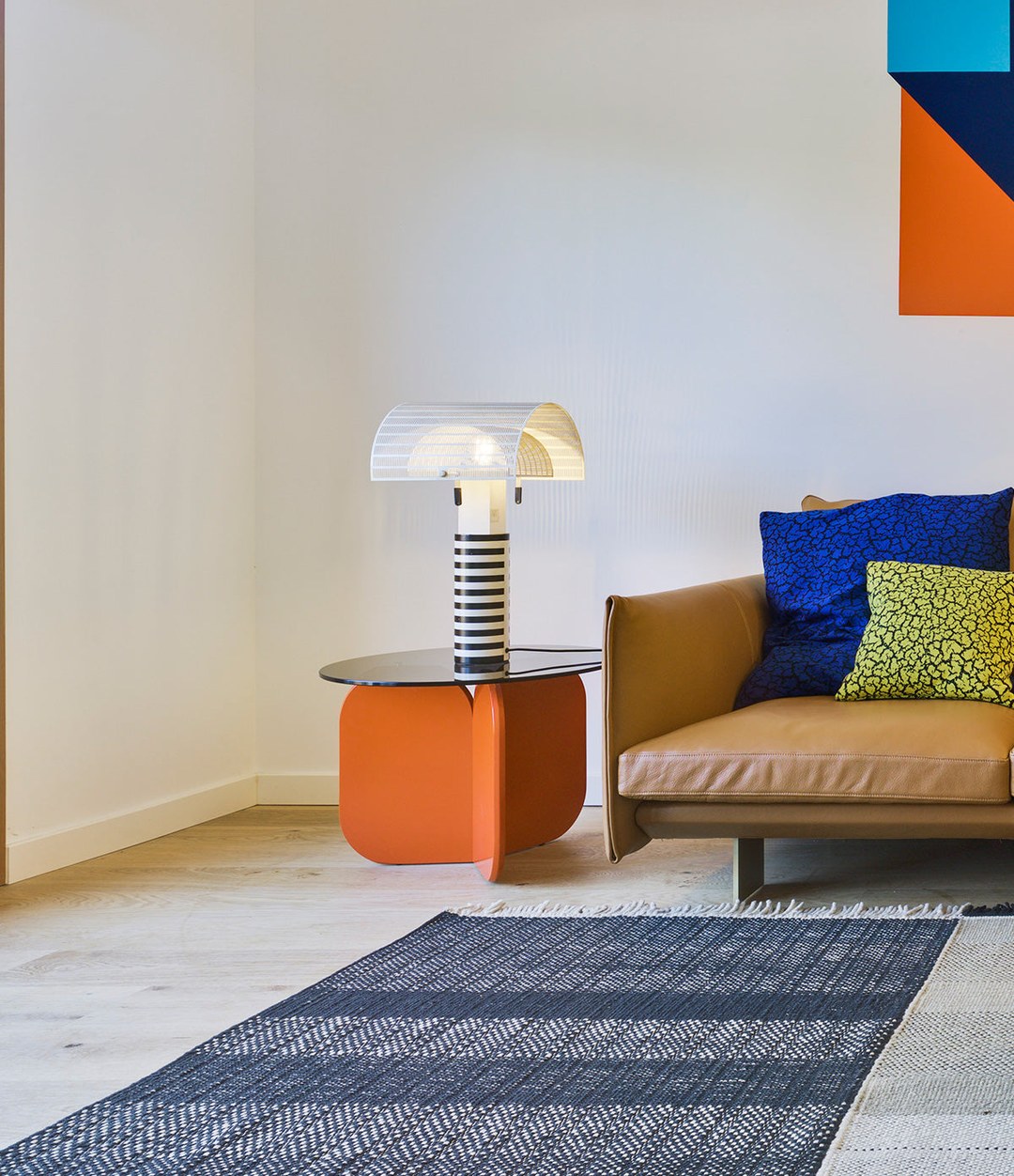 La Isla Coffee Table by Sancal in orange beside a sofa – In Dubai by WSPR