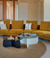 La Isla Coffee Table by Sancal in navy and white beside a velvet sofa – In Dubai by WSPR