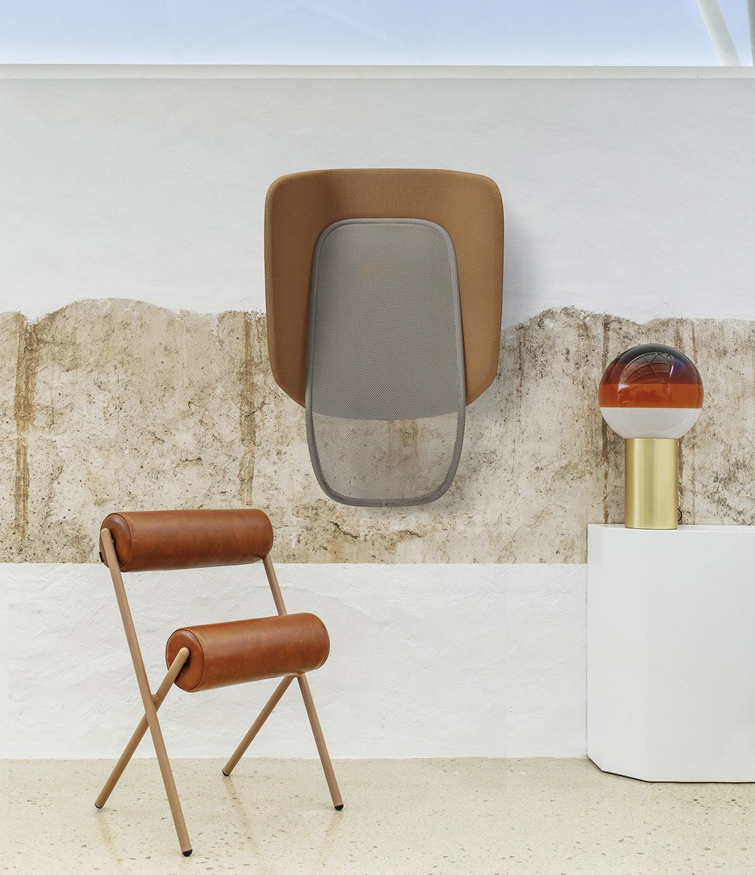 Lapso Acoustic Cabin by Sancal in brown beside a leather chair – In Dubai by WSPR