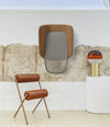 Lapso Acoustic Cabin by Sancal in brown beside a leather chair – In Dubai by WSPR
