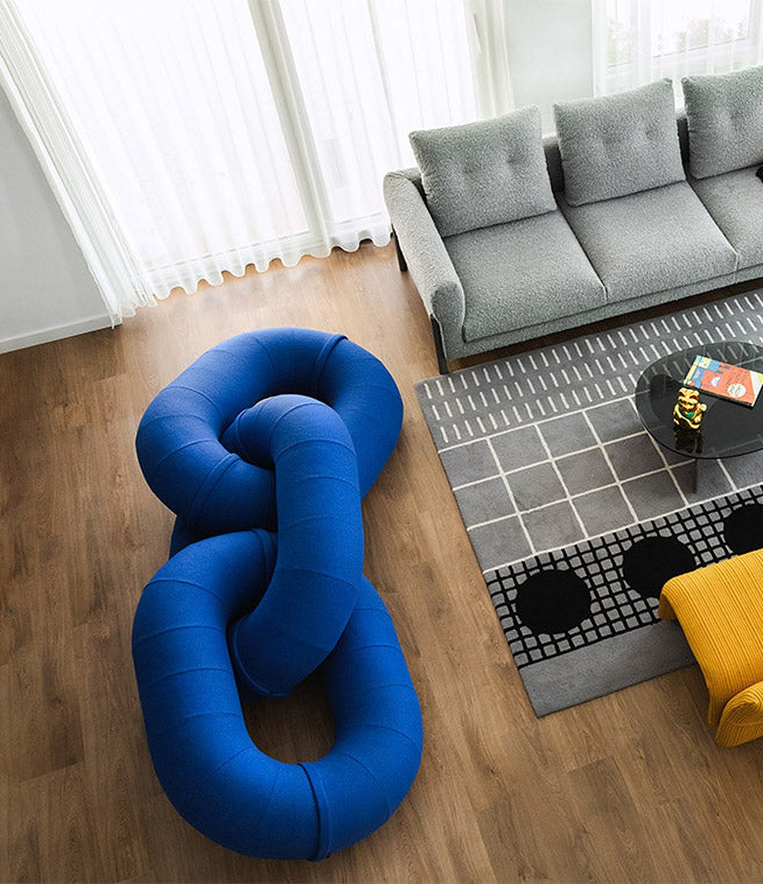 Link Sofa by Sancal in blue beside a rug – In Dubai by WSPR