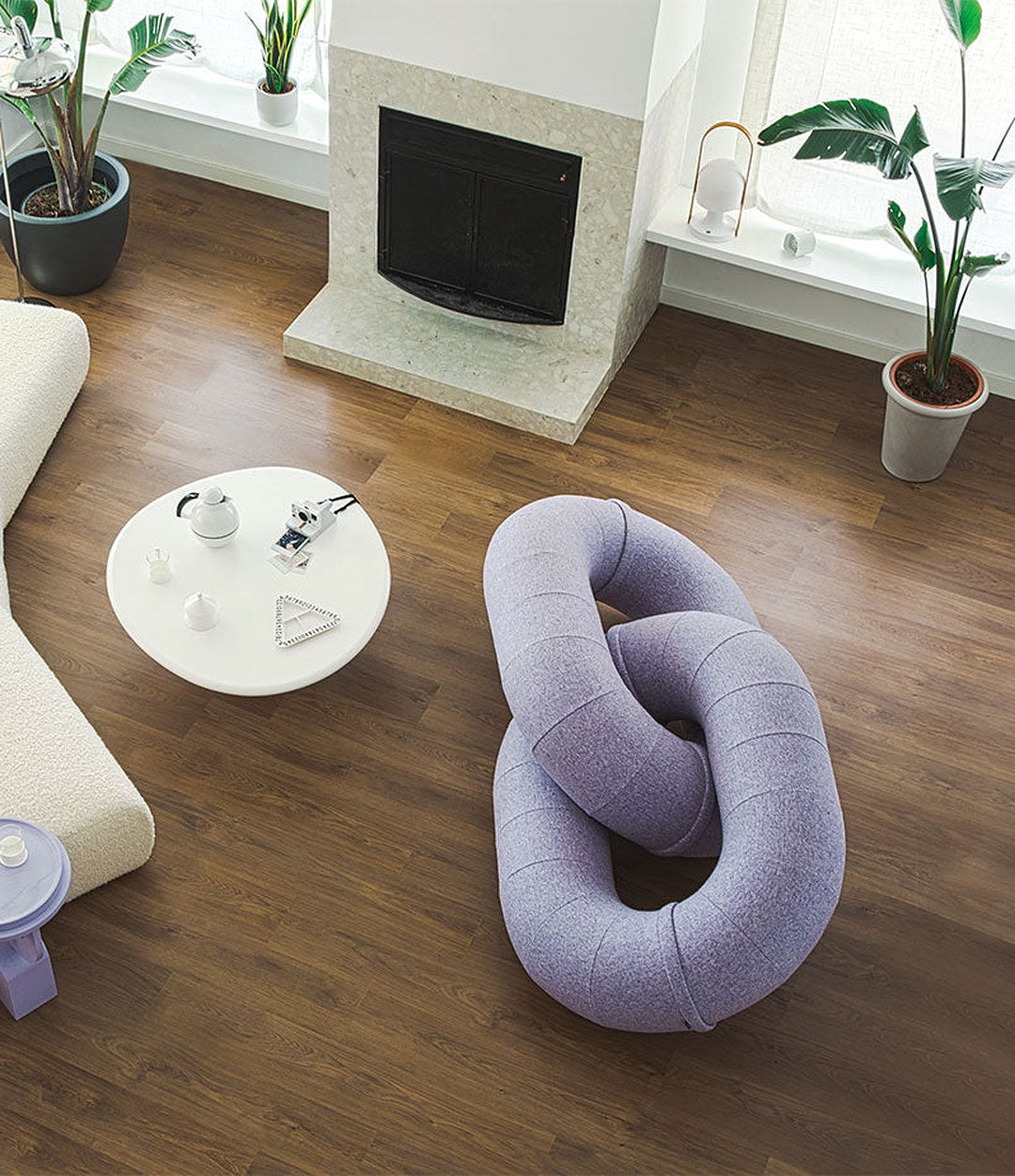 Link Sofa by Sancal in lilac by a fireplace – In Dubai by WSPR