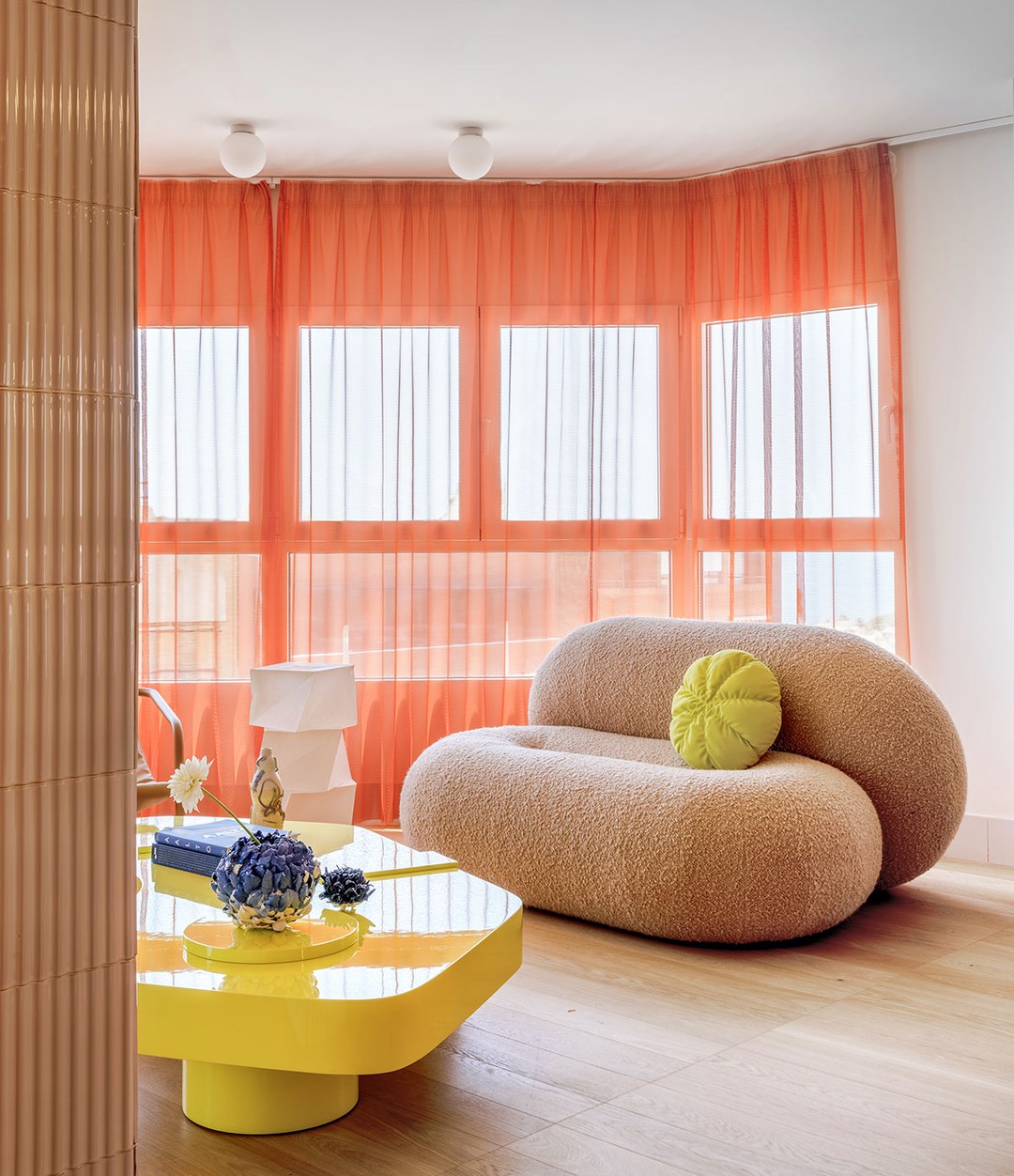 Loop Sofa by Sancal in beige with a yellow table – In Dubai by WSPR