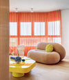Loop Sofa by Sancal in beige with a yellow table – In Dubai by WSPR