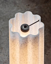 Lucerama Floor Lamp by Miniforms styled in a close view of the wavy shade and its lit top – In Dubai by WSPR