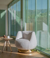 Magnum Lounge Chair by Sancal in a patterned fabric by a window – In Dubai by WSPR