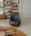 Magnum Lounge Chair by Sancal in charcoal beside a bookcase – In Dubai by WSPR