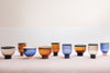 Mastea Coffee Table by Miniforms, lineup in Amber, Blue and Smoke Grey glass – In Dubai by WSPR