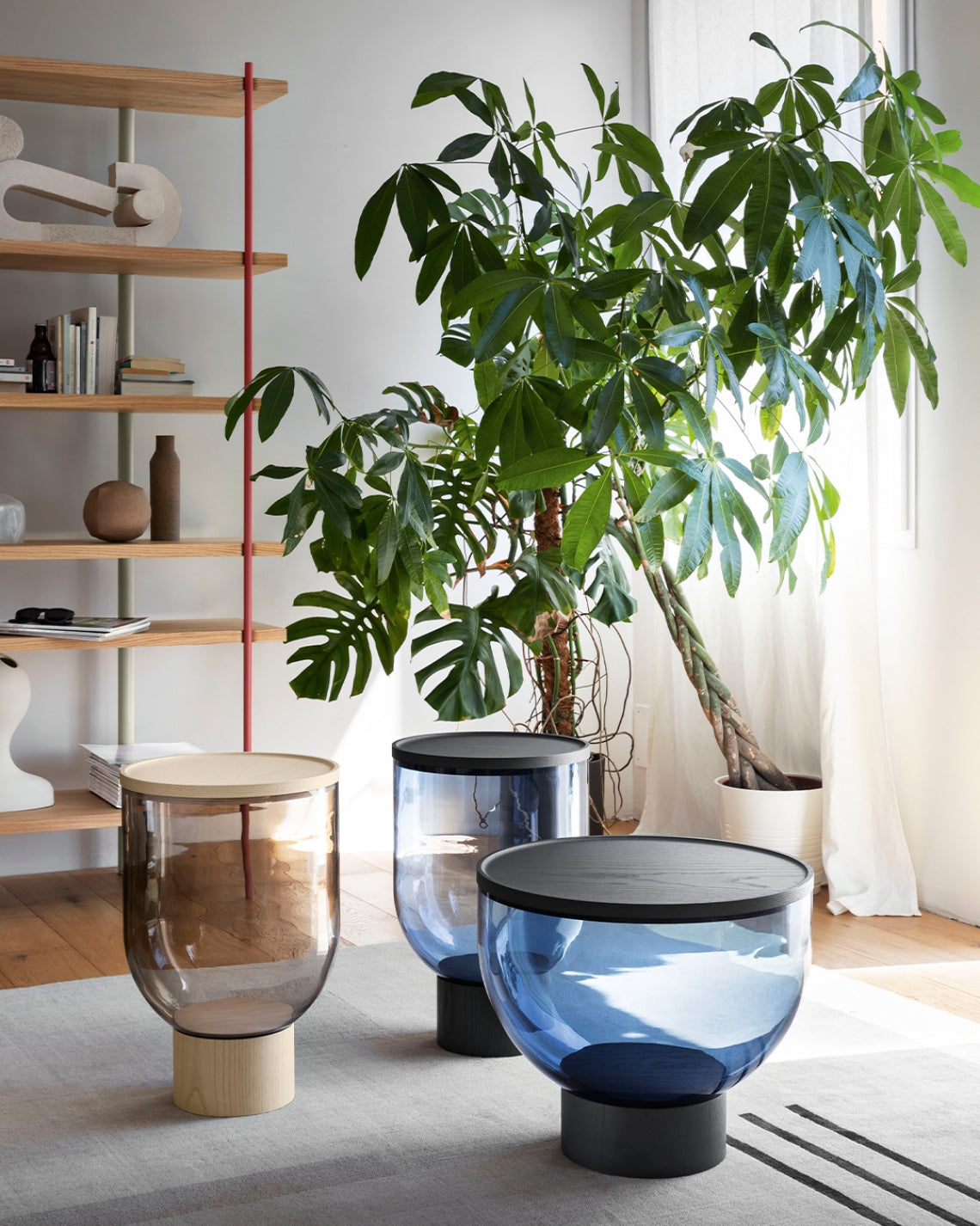 Mastea Coffee Table by Miniforms styled in a bright living room beside a bookcase and plants – In Dubai by WSPR