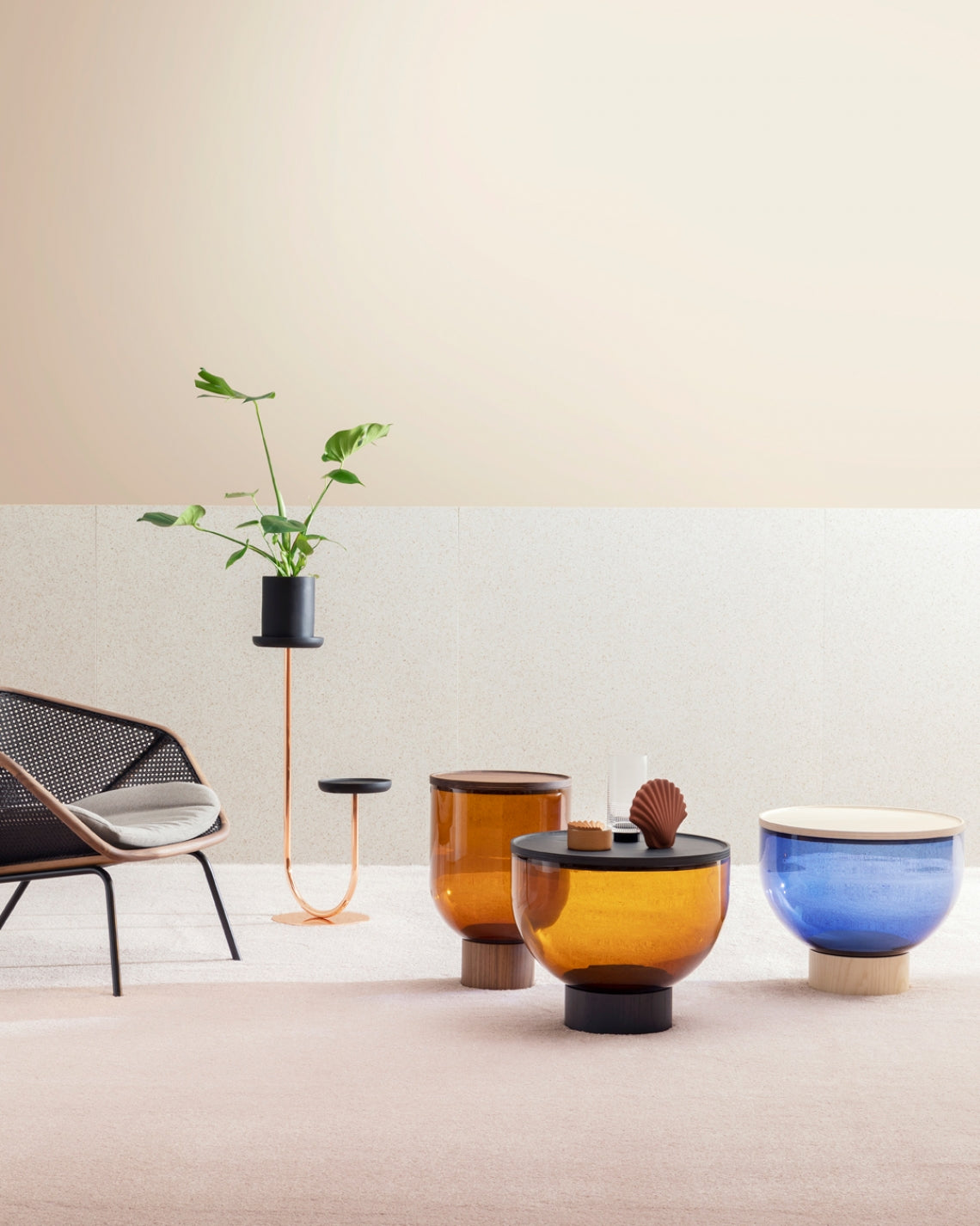 Mastea Coffee Table by Miniforms styled with a plant and lounge chair in a soft beige room – In Dubai by WSPR