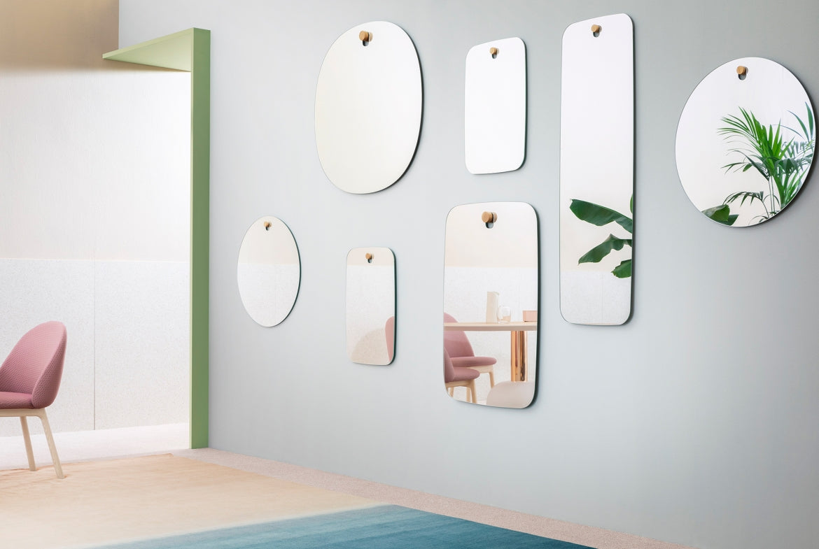 Les Brothers Mirror by Miniforms styled in a group of mirrors on a pale green wall – In Dubai by WSPR