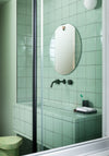 Les Brothers Mirror by Miniforms styled in a mint-tiled bathroom – In Dubai by WSPR