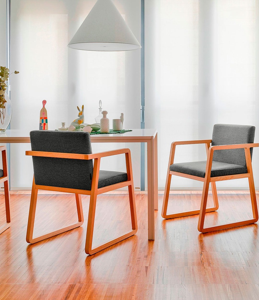 Midori Small Armchair by Sancal in orange-stained ash in a dining room – In Dubai by WSPR