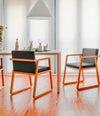 Midori Small Armchair by Sancal in orange-stained ash in a dining room – In Dubai by WSPR