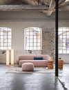 Milo Mila Coffee Table by Miniforms styled beside a rounded pink sofa in a loft with tall windows – In Dubai by WSPR