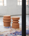 Milo Mila Coffee Table by Miniforms styled on a colourful rug in a bright industrial space, Milo and Mila side by side – In Dubai by WSPR