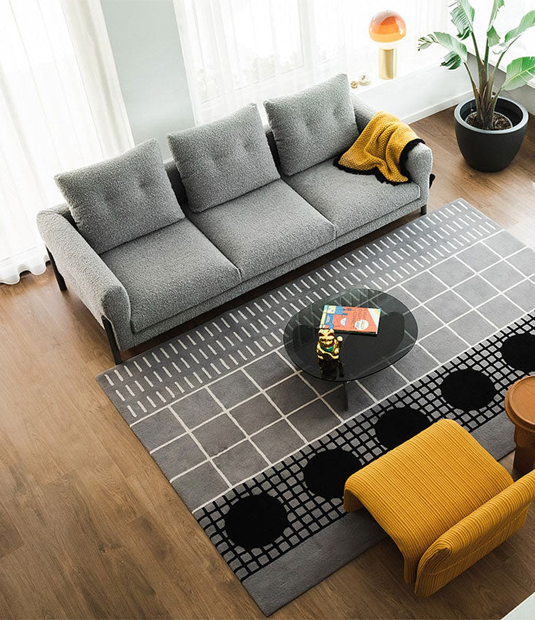 Momic Sofa by Sancal in grey with a yellow armchair – In Dubai by WSPR
