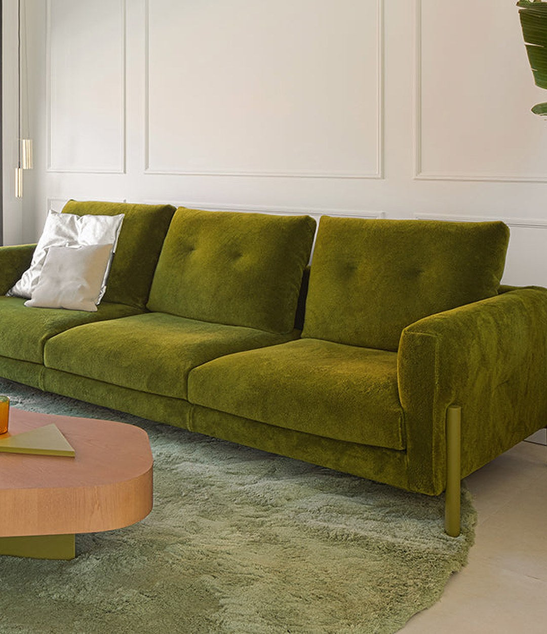 Momic Sofa by Sancal in green velvet with a pink coffee table – In Dubai by WSPR