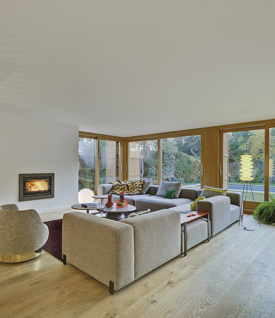Mousse Modular Sofa by Sancal corner composition in cream by a fireplace – In Dubai by WSPR
