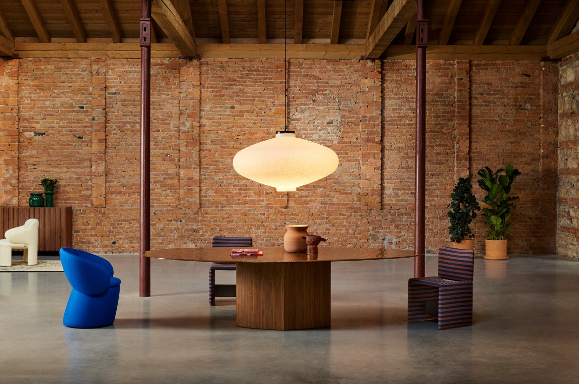 Muna Pendant by Miniforms styled in a loft with a wide round table and colourful chairs – In Dubai by WSPR