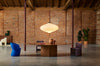 Muna Pendant by Miniforms styled in a loft with a wide round table and colourful chairs – In Dubai by WSPR