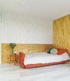 Nap Sofa Bed by Sancal opened into a bed in a plywood room – In Dubai by WSPR