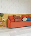 Nap Sofa Bed by Sancal in orange in a plywood room – In Dubai by WSPR