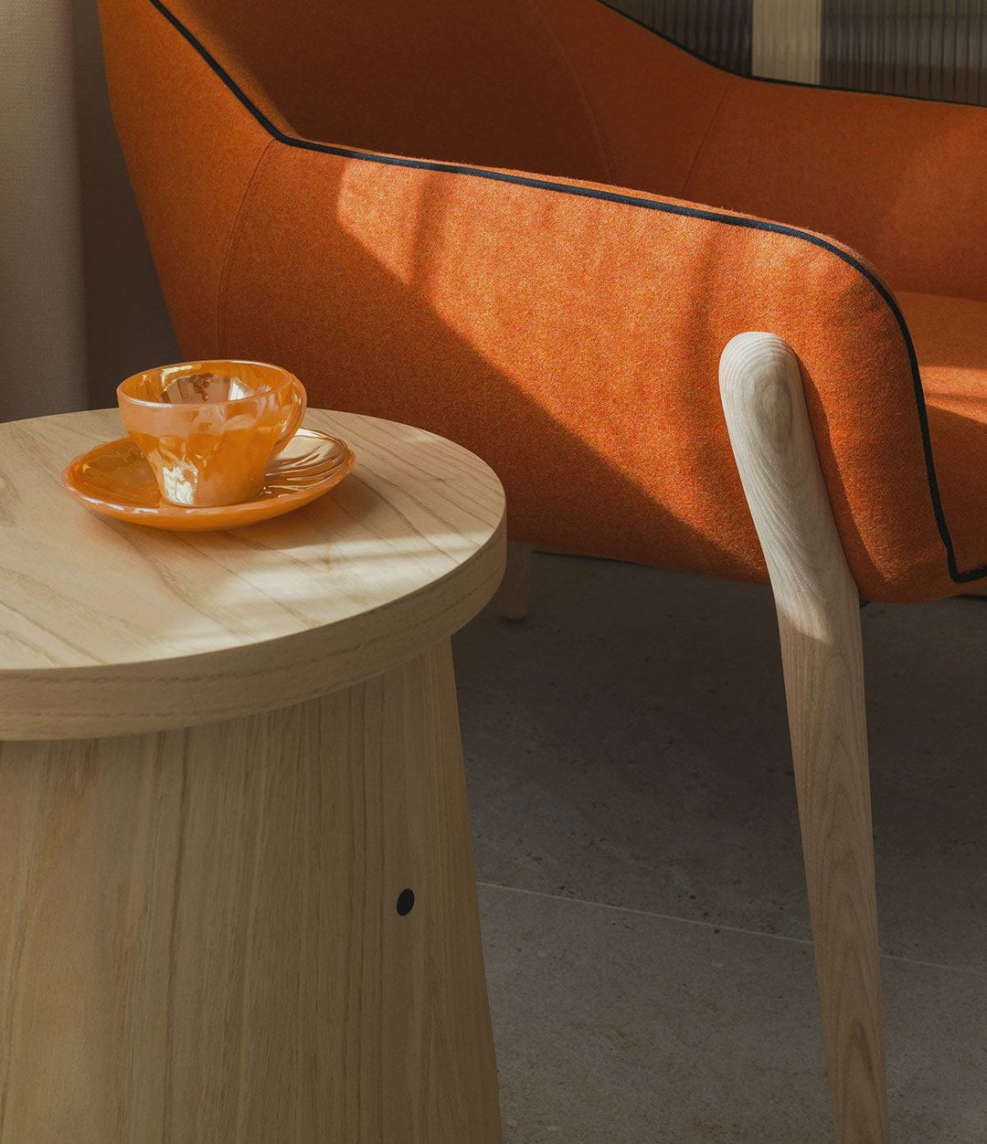 Nido Small Armchair by Sancal in orange with a wooden side table – In Dubai by WSPR