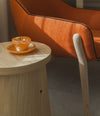 Nido Small Armchair by Sancal in orange with a wooden side table – In Dubai by WSPR