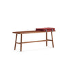 Nudo Bench by Sancal in stained oak with a red blanket – In Dubai by WSPR