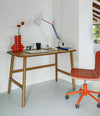 Nudo Desk by Sancal in walnut stain with an orange chair – In Dubai by WSPR