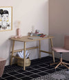 Nudo Desk by Sancal in light oak on a patterned floor – In Dubai by WSPR