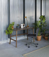 Nudo Desk by Sancal in walnut stain in an industrial space – In Dubai by WSPR