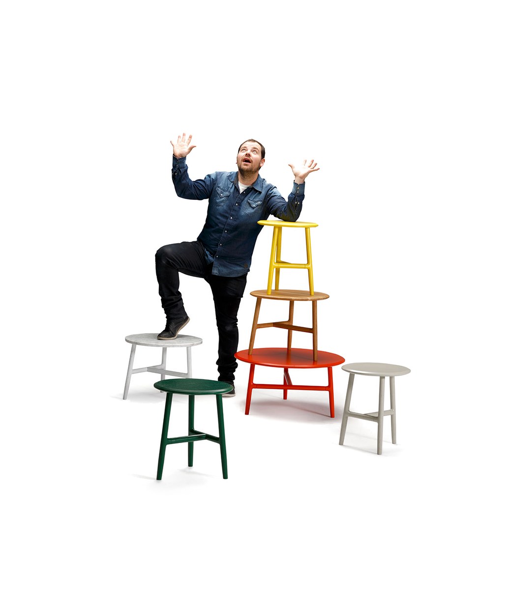 Nudo Side Table by Sancal a stack of tables with a man climbing them – In Dubai by WSPR