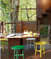 Nudo Side Table by Sancal in green and yellow on a terrace – In Dubai by WSPR