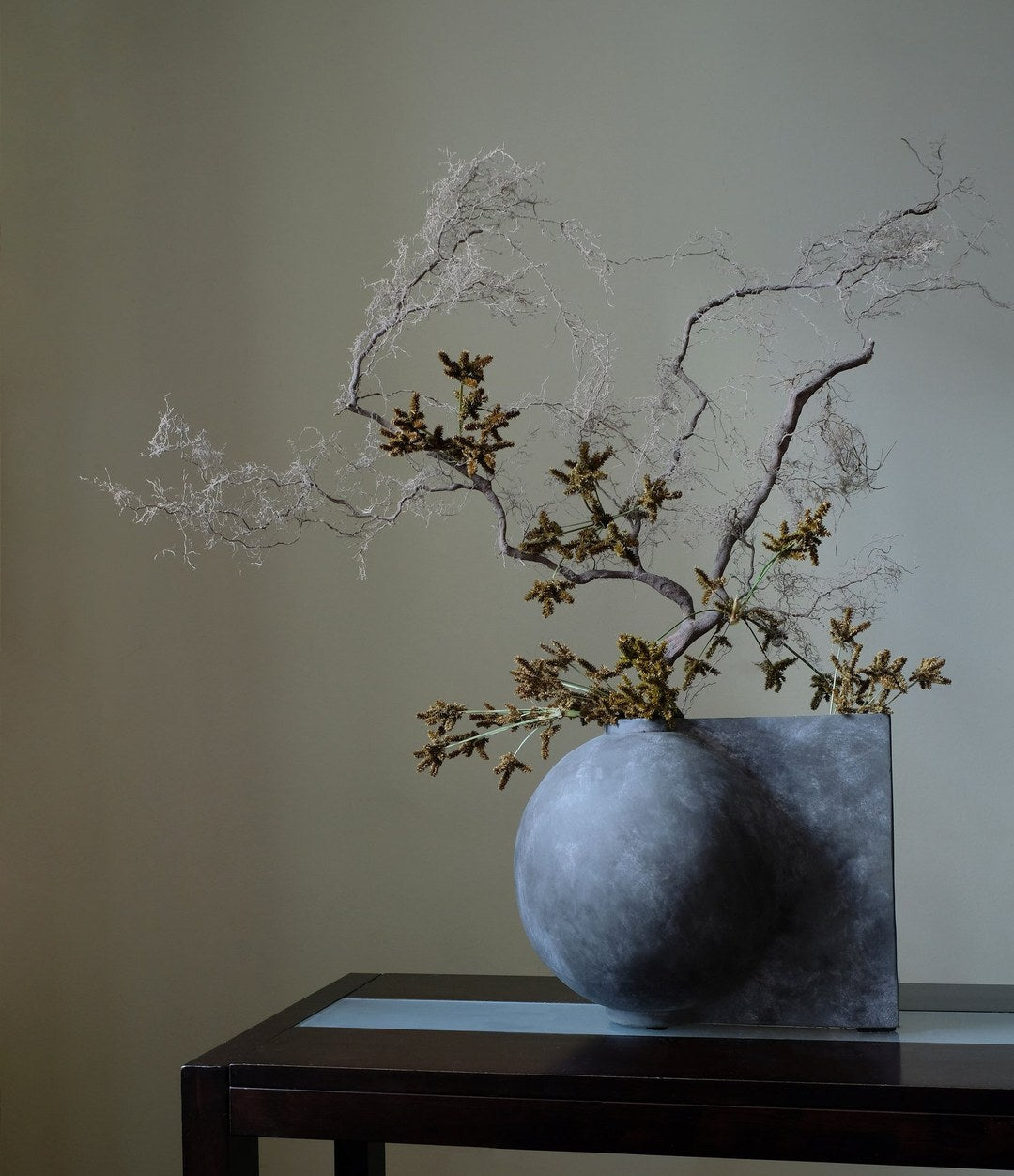 Offset Vase, Mini by 101 Copenhagen in Dark Grey in a styled interior – In Dubai by WSPR