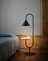 Ozz Lamp by Miniforms in black with a natural ash shelf beside a bed – In Dubai by WSPR