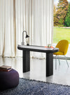 Ozz Desk Lamp by Miniforms styled on a dark desk in front of sheer curtains – In Dubai by WSPR