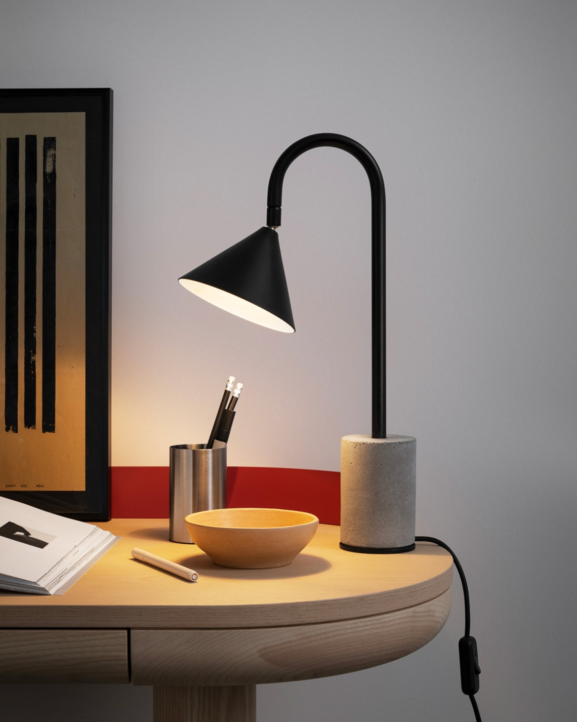 Ozz Desk Lamp by Miniforms styled on a wooden desk with a bowl and pencil pot, close view – In Dubai by WSPR