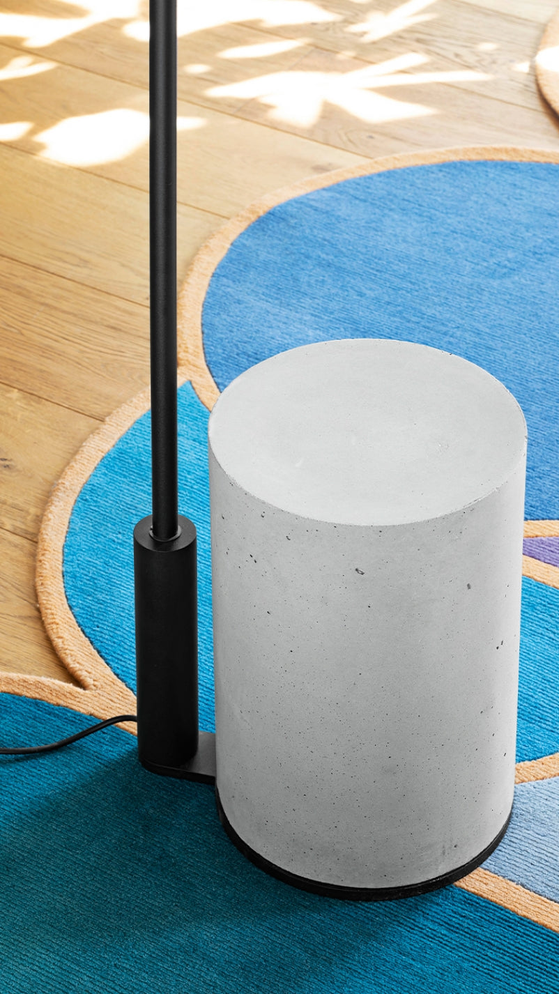 Ozz Floor Lamp by Miniforms, close view of the concrete base on a blue rug – In Dubai by WSPR