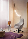 Pinto Coffee Table by Miniforms in a pale concrete finish beside a grey armchair – In Dubai by WSPR
