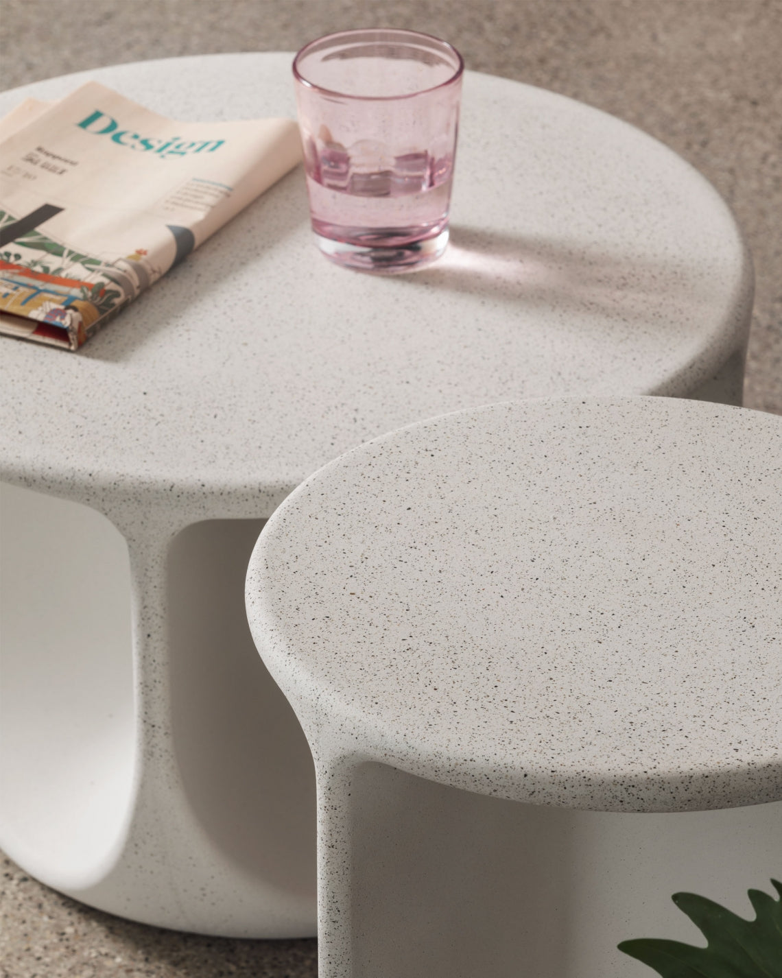 Pinto Coffee Table by Miniforms in a pale concrete finish, two sizes grouped with a magazine and glass – In Dubai by WSPR