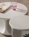 Pinto Coffee Table by Miniforms in a pale concrete finish, two sizes grouped with a magazine and glass – In Dubai by WSPR