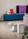 Pinto Coffee Table by Miniforms in a pale concrete finish, two sizes in a living room with a blue sideboard – In Dubai by WSPR