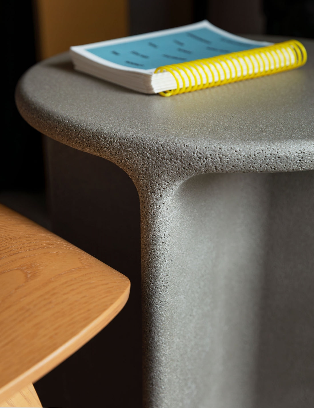 Pinto Coffee Table by Miniforms in a grey concrete finish, detail of the curved base – In Dubai by WSPR